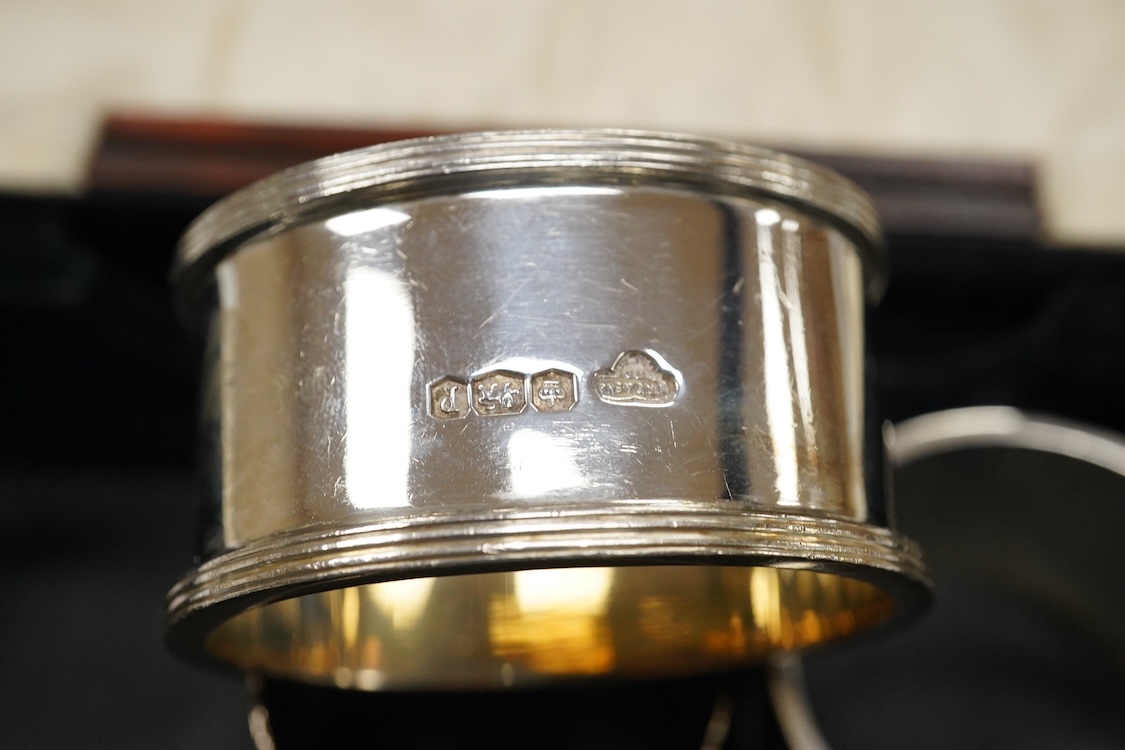 Three assorted 20th century silver napkin rings, a George V silver mustard pot and pepperette, a set of six late Victorian silver coffee spoons, London, 1883, and six other silver items.